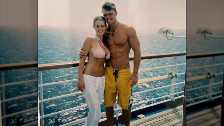 Catherine Ritchson and Alan Ritchson wearing swimsuits on a boat