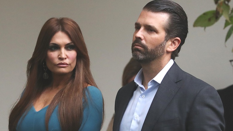 Kimberly Guilfoyle and Donald Trump Jr. look serious